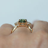 2.11ct Oval Color Shifting Madagascar Sapphire and Diamond Three Stone Ring in 14k Yellow Gold on hand