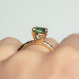 2.23ct Oval Seafoam Montana Sapphire Evergreen Solitaire in 14k Yellow Gold profile shot on hand