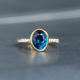 2.53ct Oval Blue Nigerian Sapphire Low Profile Bezel with French Set Diamonds 18k Yellow