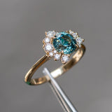 1.73ct Round Madagascar Teal Sapphire and Asymmetrical Diamond Cluster Ring in 14k Yellow Gold