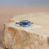 2.02ct Emerald Cut Bicolor Sapphire and Blue Sapphire Side Stone Cluster Ring in Two Tone 14k Yellow and White Gold