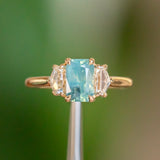1.47ct Radiant Opalescent Teal Sapphire and White Sapphire Three Stone Ring in 14k Yellow Gold