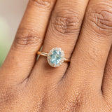 1.04ct Oval Montana Sapphire Six Prong Halo Ring in 14k Yellow Gold