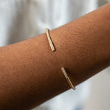 Flexi-Bangle with diamonds in satin finished solid 14k white and yellow gold