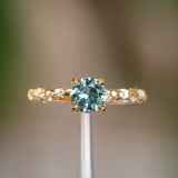 0.96ct Round Color-Shifting Sapphire in 18k Yellow Gold Evergreen Solitaire with Scattered Embedded Diamonds