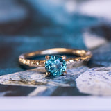 0.86ct Round Montana Sapphire Evergreen Carved Solitaire in 14k Yellow Gold