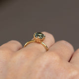 3.03ct Oval Montana Sapphire Scallop Cup Sapphire Solitaire in 18K Yellow Gold on the hand