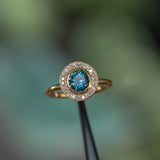 1.22ct Deep Teal Montana Sapphire With Bezel Set Diamond Halo In 18k Yellow Gold