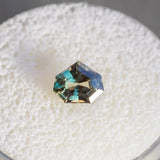 1.03CT SHIELD TANZANIAN SAPPHIRE, PARTI GREEN AND COGNAC, 6.6X5.5X3.7MM, UNTREATED