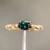 0.85ct Oval Sapphire in 14k Yellow Gold Evergreen Solitaire with Scattered Embedded Diamonds
