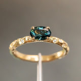 0.85ct Oval Sapphire in 14k Yellow Gold Evergreen Solitaire with Scattered Embedded Diamonds