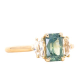 1.47ct Radiant Opalescent Teal Sapphire and White Sapphire Three Stone Ring in 14k Yellow Gold