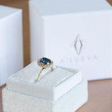 1.32ct Royal Blue Oval Sapphire Halo Ring - Evergreen Carved Band in a Satin Finish 14k Yellow Gold