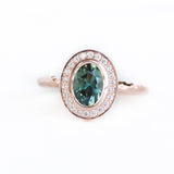 Oval Bezel Set 1.49ct Color Changing Teal Sapphire and Diamond Halo Engagement Ring - 14k Rose Gold Evergreen Band