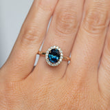 1.63ct Oval Deep Blue Unheated Sapphire and Diamond Six Prong Halo Evergreen Ring in 14k Yellow Gold