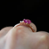 1.61ct Oval Neon Pink Sapphire and Diamond Asymmetrical Ring in 14k Rose Gold on hand