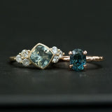 Minty Cushion Cut Sapphire Ring with Diamond Cluster Side Stones in Bezel Yellow Gold