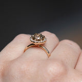 1.85ct GIA Crown Jubilee® Diamond Six Prong Halo Ring in 14k Yellow Gold angled on hand