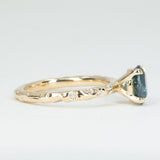 1.79ct Oval Blue Color Changing Sapphire in 14k Yellow Gold Evergreen Solitaire with Scattered Embedded Diamonds