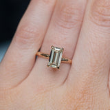 1.30ct Light Champagne Emerald Cut Diamond Solitaire Evergreen Ring In 14k Yellow Gold on hand