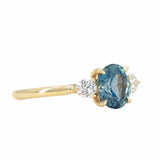 1.54ct Oval Montana Sapphire and Diamond Three Stone Ring in 14k Yellow Gold side angle