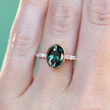 3.23ct Oval Color-Shifting Sapphire Bezel with French Set Diamonds in 18k Rose Gold