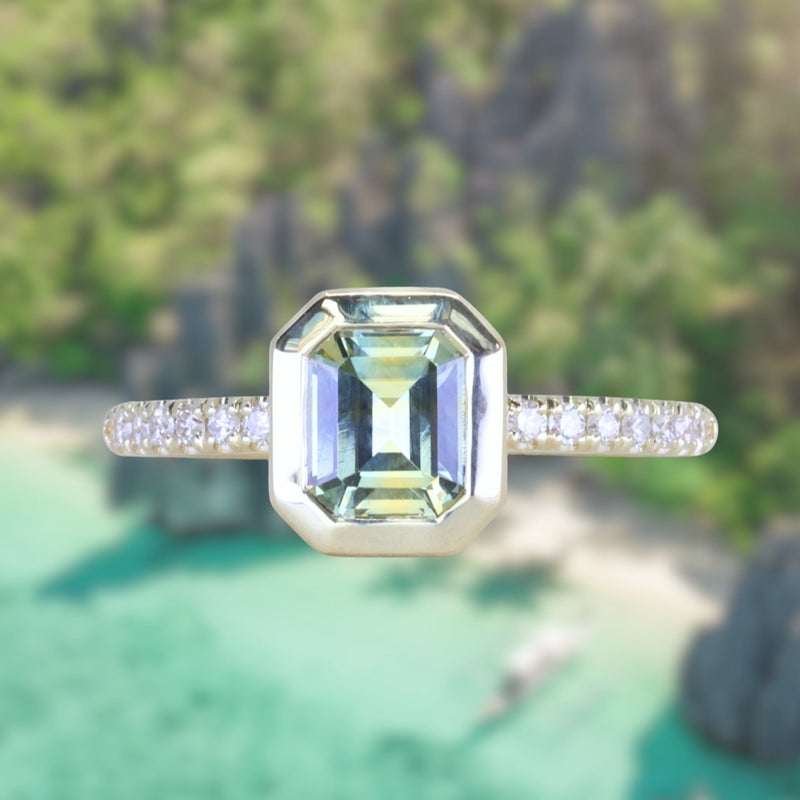 1.14ct Emerald Cut Parti Montana Sapphire Low Profile Bezel Solitaire Ring with Pavé Set Diamonds in 14k Green Gold
