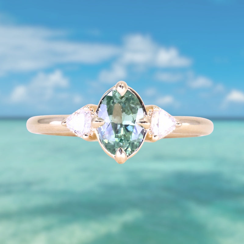 0.73ct Oval Unheated Montana Sapphire and Trillion Diamond Low Profile Ring in 14k Yellow Gold