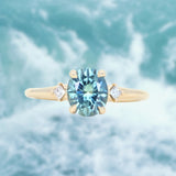 1.77ct Oval Precision Cut Parti Light Teal Montana Sapphire and Princess Cut Diamond Rapids Low Profile Ring in 14k Yellow Gold