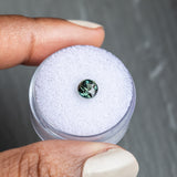 1.13CT BRILLIANT ROUND MADAGASCAR SAPPHIRE, COLOR SHIFTING WARM GREY TO BRIGHT GREEN TEAL, 5.72X74.42MM