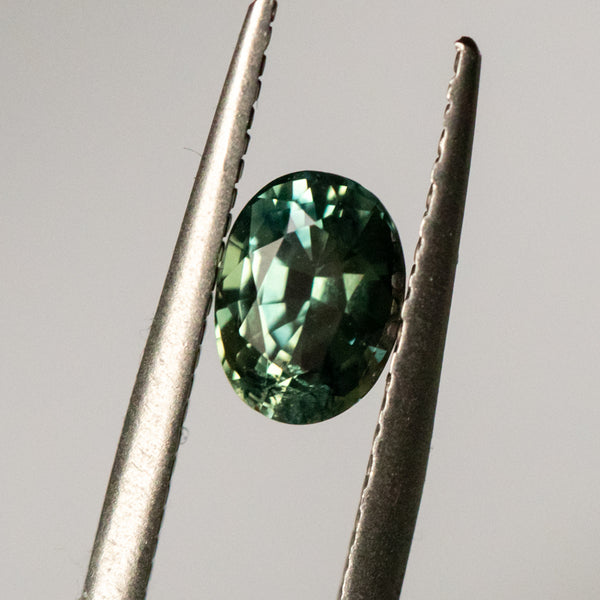 1.04CT OVAL MADAGASCAR SAPPHIRE, UNTREATED, MOSS GREEN, 6.71X4.98X3.83MM