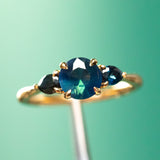 1.03ct Untreated Teal Nigerian Sapphire Three Stone Ring in 18K Yellow Gold