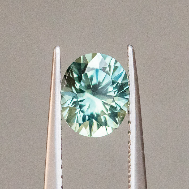 1.52CT OVAL PRECISION CUT MONTANA SAPPHIRE, LIGHT TEAL GREEN, 7.19X6.02MM