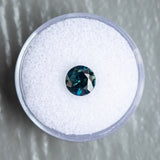 1.59CT ROUND NIGERIAN SAPPHIRE, DEEP TEAL WITH PARTI GREEN, 7.00X4.34MM, UNTREATED