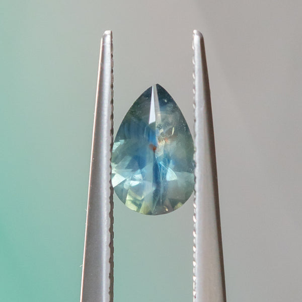 0.74CT PEAR SAPPHIRE, SILKY TEAL WITH ORANGE INCLUSION, 7.43X4.9MM