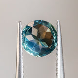 1.29CT ROUND MADAGASCAR SAPPHIRE, PARTI GREEN WITH LIGHT TEAL FLASHES, 6.2MM