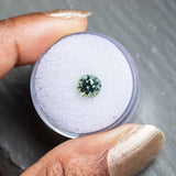 1.46CT ROUND SONGEA SAPPHIRE, COLOR SHIFTING GREEN TO GREY, 6.66X4.64MM UNTREATED