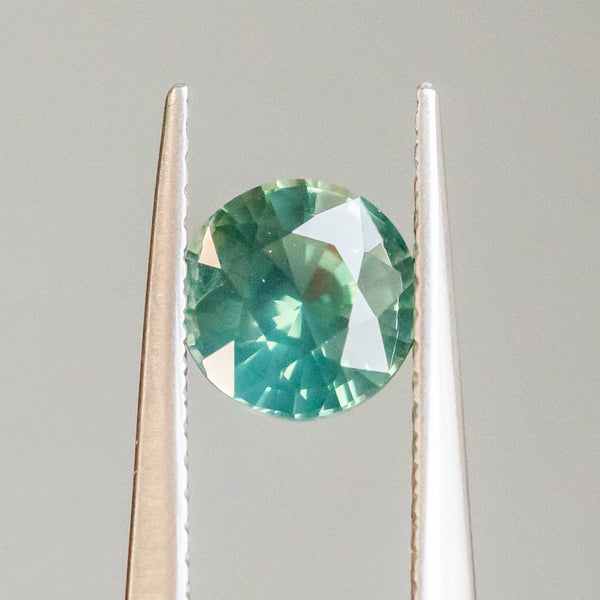 1.29CT ROUND AFRICAN SAPPHIRE, TEAL GREEN, 6.43X4.05MM