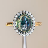 4.48ct Oval Cabochon Parti Sapphire and Blackened Halo ring in 18k Yellow Gold