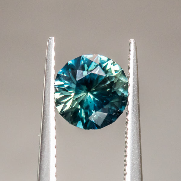 1.63CT ROUND NIGERIAN SAPPHIRE, PEACOCK GREEN, 7.01x4.50MM, UNTREATED