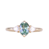 0.73ct Oval Unheated Montana Sapphire and Trillion Diamond Low Profile Ring in 14k Yellow Gold