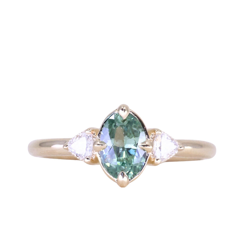 0.73ct Oval Unheated Montana Sapphire and Trillion Diamond Low Profile Ring in 14k Yellow Gold