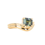 1.65ct Emerald Cut Color Shifting Madagascar Sapphire Prong Set Ripple Contour Solitaire in 14k Yellow Gold