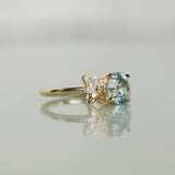 2.38ct Untreated Sky Blue Montana Sapphire in Wandering Vine Low Profile Four Prong Setting with Natural Diamonds in 14k Yellow Gold- Appraised Stone