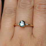 0.90ct Oval Light Blue Green Montana Sapphire and Princess Cut Diamond Rapids Low Profile Ring in 14k Yellow Gold