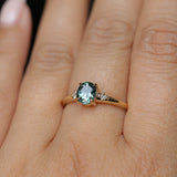 0.90ct Oval Light Blue Green Montana Sapphire and Princess Cut Diamond Rapids Low Profile Ring in 14k Yellow Gold