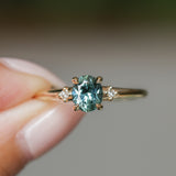 0.90ct Oval Light Blue Green Montana Sapphire and Princess Cut Diamond Rapids Low Profile Ring in 14k Yellow Gold