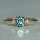 0.90ct Oval Light Blue Green Montana Sapphire and Princess Cut Diamond Rapids Low Profile Ring in 14k Yellow Gold