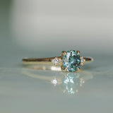 0.90ct Oval Light Blue Green Montana Sapphire and Princess Cut Diamond Rapids Low Profile Ring in 14k Yellow Gold
