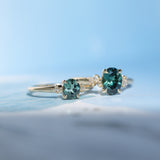 0.90ct Oval Light Blue Green Montana Sapphire and Princess Cut Diamond Rapids Low Profile Ring in 14k Yellow Gold